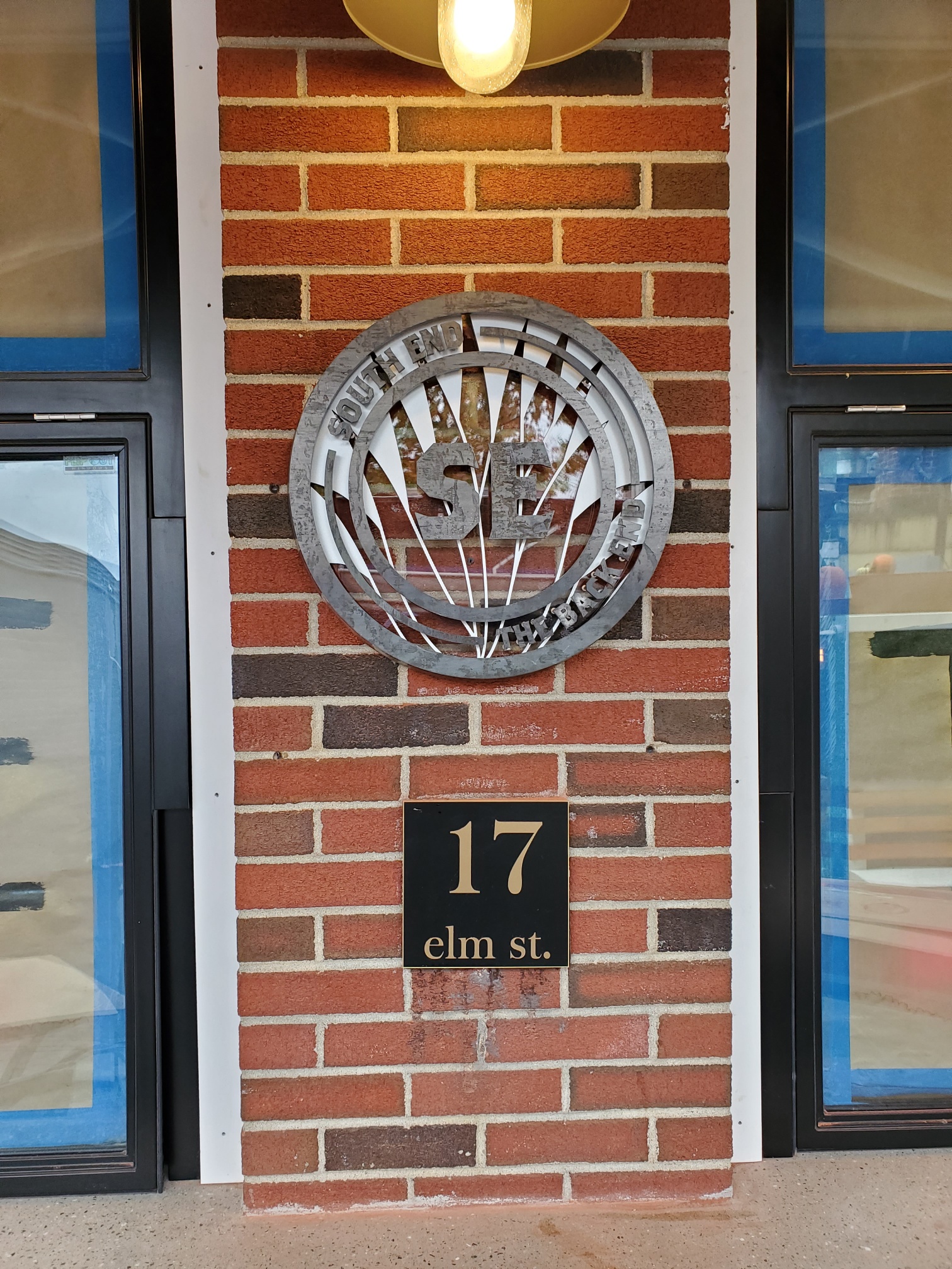 aluminum logo onto wall